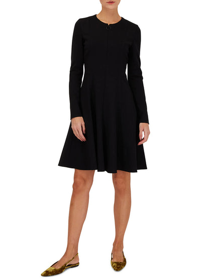 A woman wearing an Akris Punto Elements Long Sleeve Fit & Flare Dress in Black with a ring zip pull.