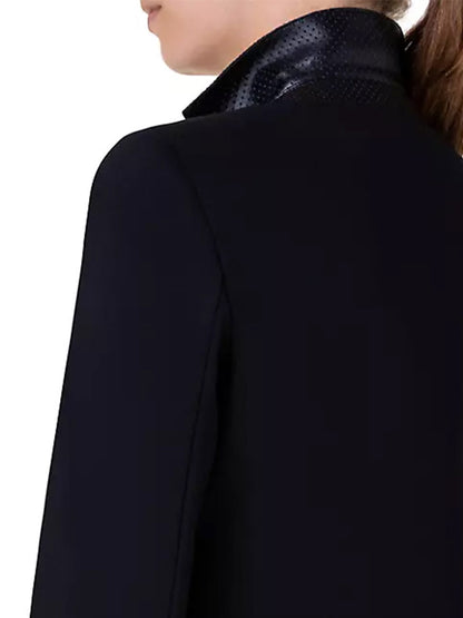 The back view of a woman wearing an Akris Punto Elements One-Button Jersey Blazer in Black.