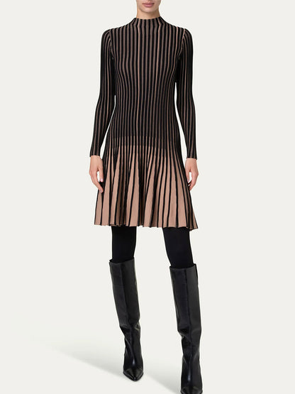 Person wearing an Akris Punto Ribbed Fit-and-Flare Dress in Black/Caramel, paired with black tights and knee-high black boots, standing against a plain background.