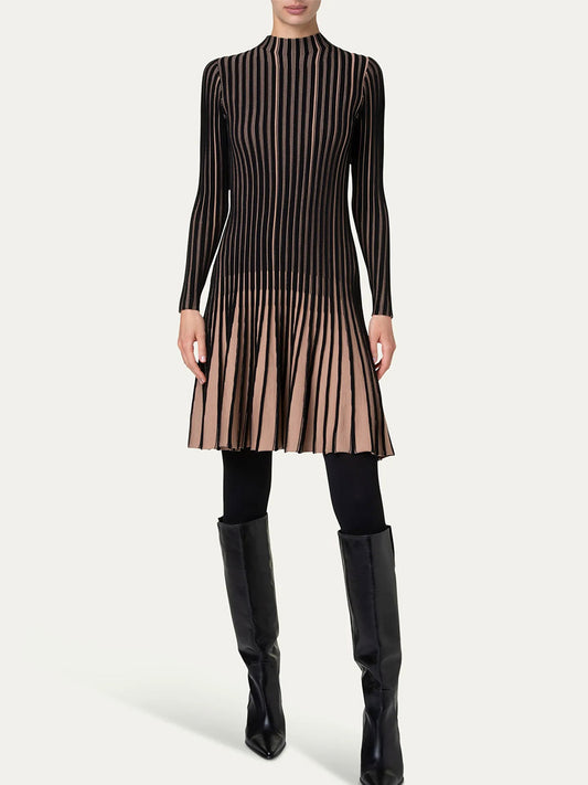 Person wearing an Akris Punto Ribbed Fit-and-Flare Dress in Black/Caramel, paired with black tights and knee-high black boots, standing against a plain background.