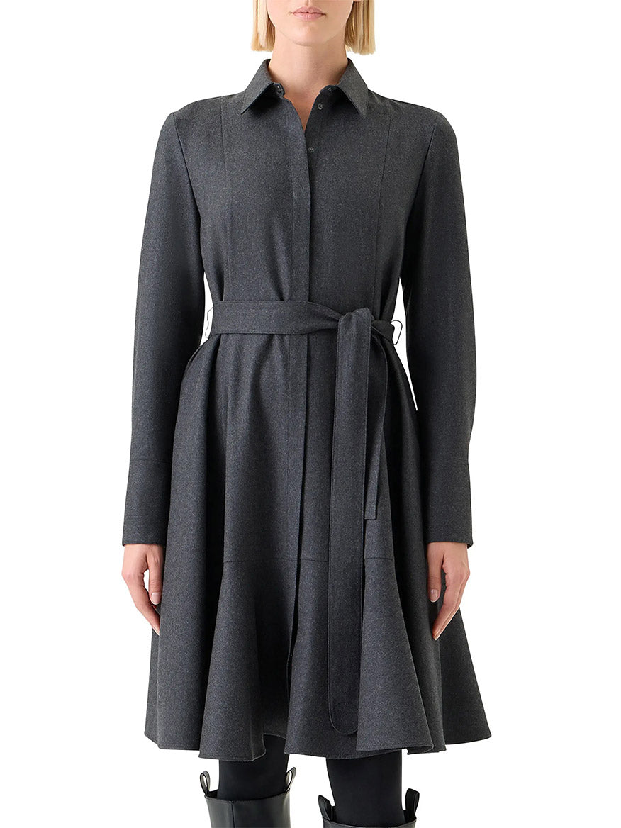 A woman wears the Akris Punto Flannel Wool Belted Shirtdress in Charcoal, featuring a collared, fit-and-flare silhouette, made from virgin wool, standing against a white background.