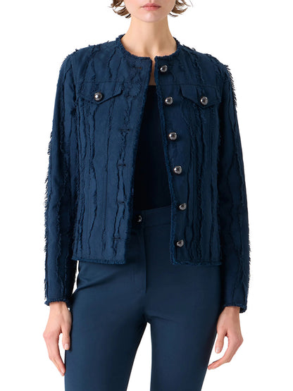 A person wearing the Akris Punto Fringed Wave Jacquard Jacket in Dark Blue, featuring frayed vertical stripes, button-front closure, chest flap pockets, reflective buttons, and matching navy pants.