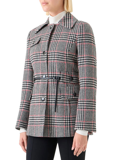 A woman wears the Akris Punto Glencheck Wool-Blend Jacket in Black/Cream/Vermillion, styled over a white turtleneck and black pants.