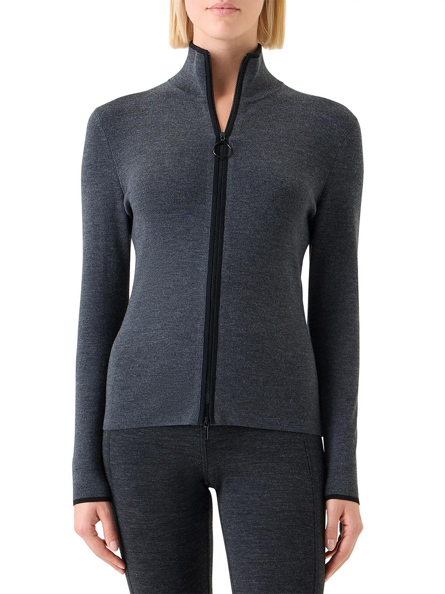 Someone wearing an Akris Punto Virgin Wool Knit Zip Cardigan in Charcoal/Black, paired with matching pants, stands against a white background.
