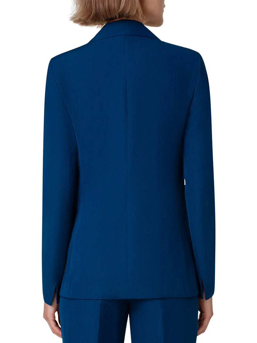 The back view of a woman in an Akris Punto Notched Lapel One-Button Blazer in Ink blue suit.