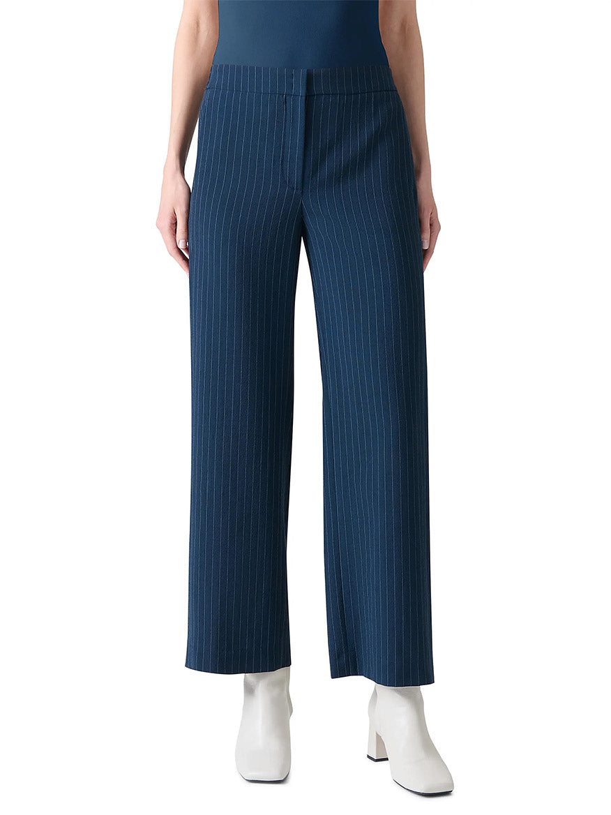 A person models the Akris Punto Marlon Pinstripe Wide Leg Pant in Navy/Cream, paired with white ankle boots and shown from waist to feet against a plain background.