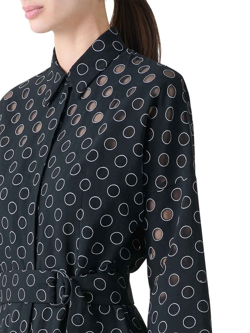 A person wears the Akris Punto Midi Polka Dot Organzino Belted Dress in Black/Cream, featuring bracelet-length sleeves and a waist belt, against a plain white background.