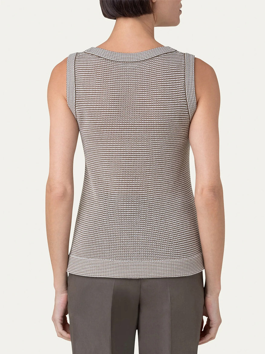 The back view of a woman wearing an Akris Punto Ribbed Sleeveless Wool Knit Top in Nutmeg/Cream.