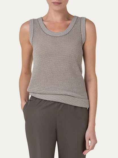 A woman wearing a grey Akris Punto Ribbed Sleeveless Wool Knit Top in Nutmeg/Cream.