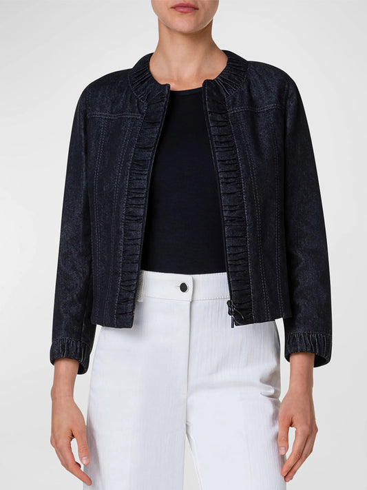 A woman wearing an Akris Punto Ruched-Edge Denim Short Jacket in Black paired with white pants.