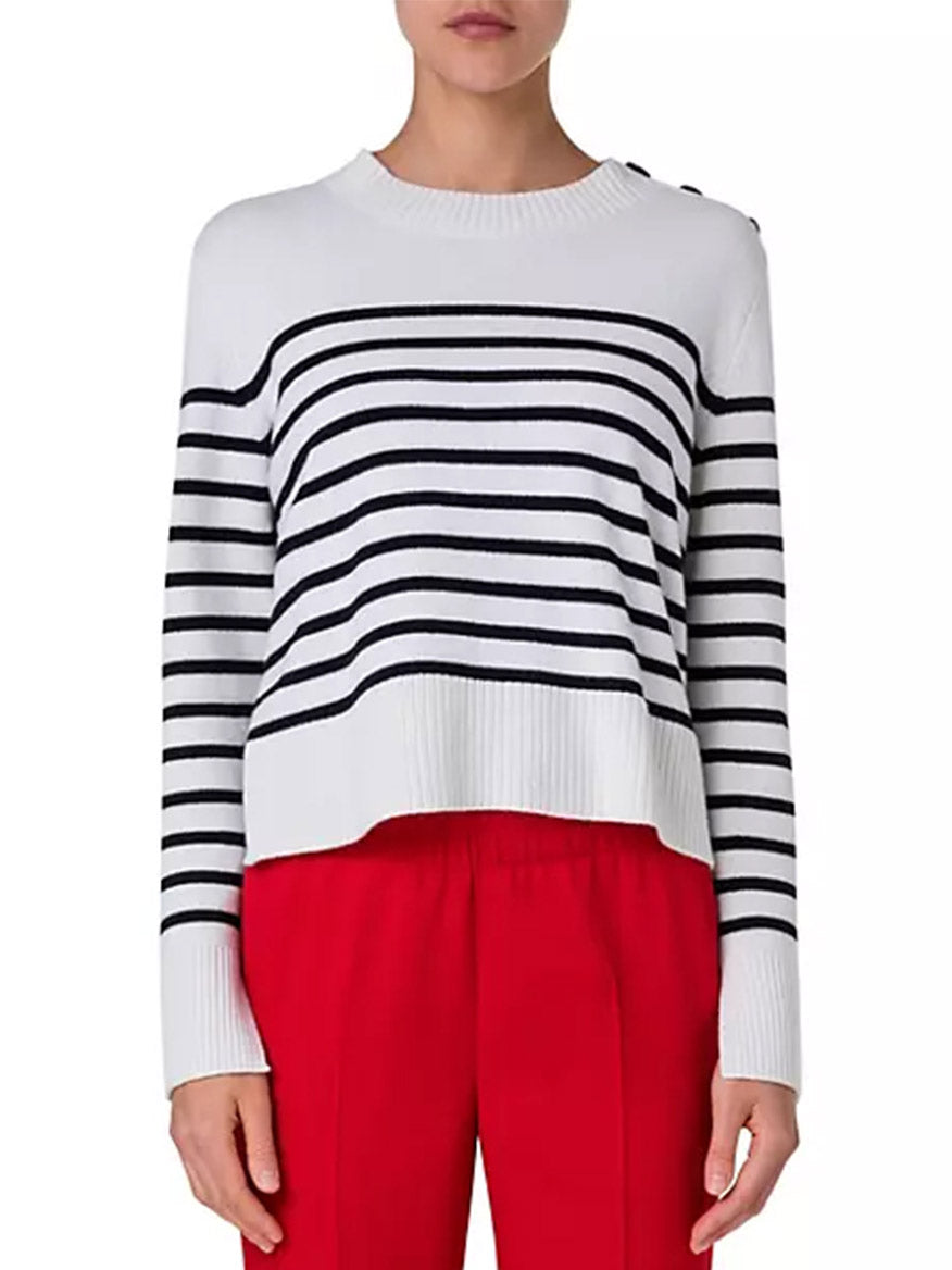 A woman wearing an Akris Punto Striped Crew Sweater With Snap Shoulder in Cream/Black.