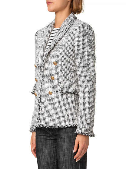 A person in a cream/black Akris Punto Tweed Illusion Double Breasted Jacket, gold buttons, black and white striped shirt, and dark jeans is seen from the side against a plain background.