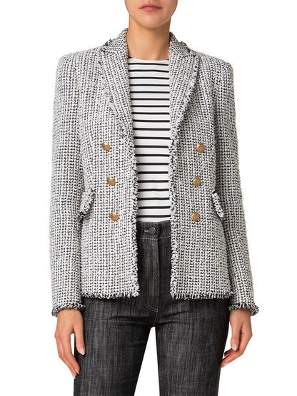 A person wears an Akris Punto Tweed Illusion Double Breasted Jacket in Cream/Black with a textured look and frayed edges, pairing it with a striped shirt and dark jeans.