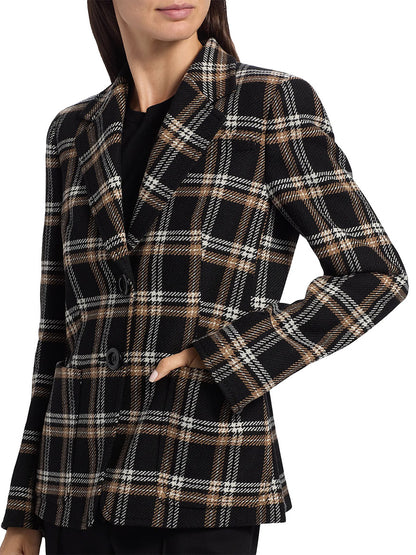 A woman wears the Akris Punto Tweed Plaid Structured Blazer in Black/Camel/Cream, paired with a black shirt and black pants.