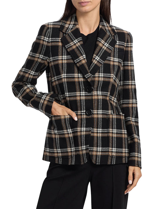 A woman wears the Akris Punto Tweed Plaid Structured Blazer in Black/Camel/Cream with black trousers and a black top, standing with one hand in her pocket.