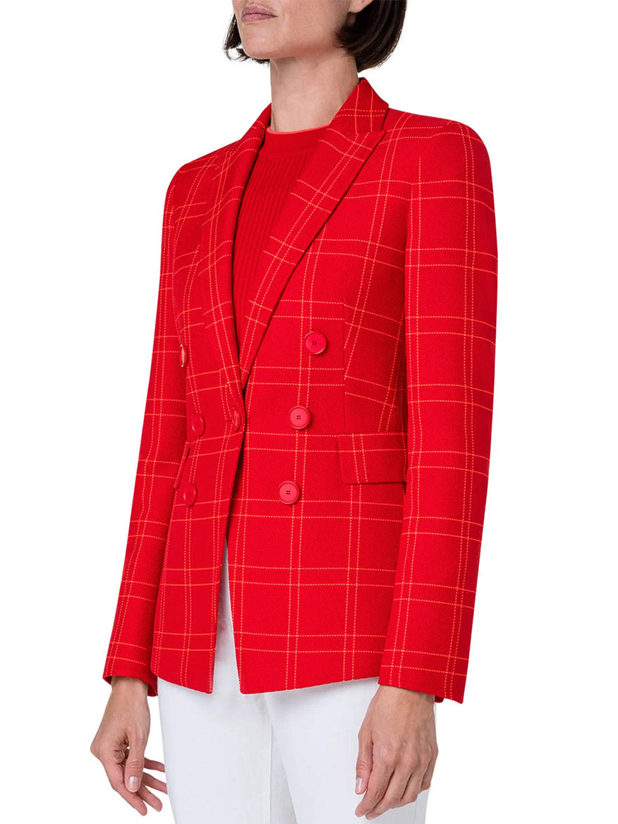 A woman wearing an Akris Punto Window Check Blazer in Red.