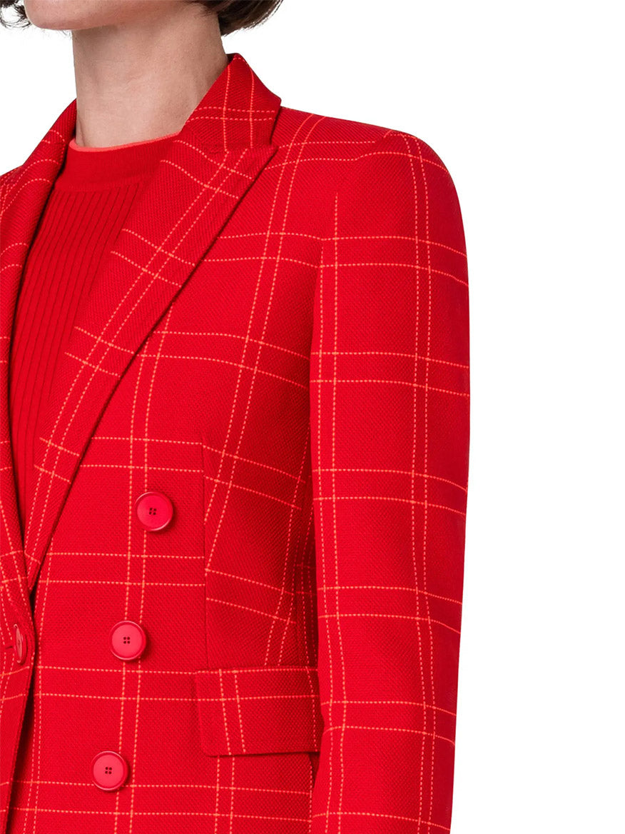 A woman is wearing an Akris Punto Window Check Blazer in Red.