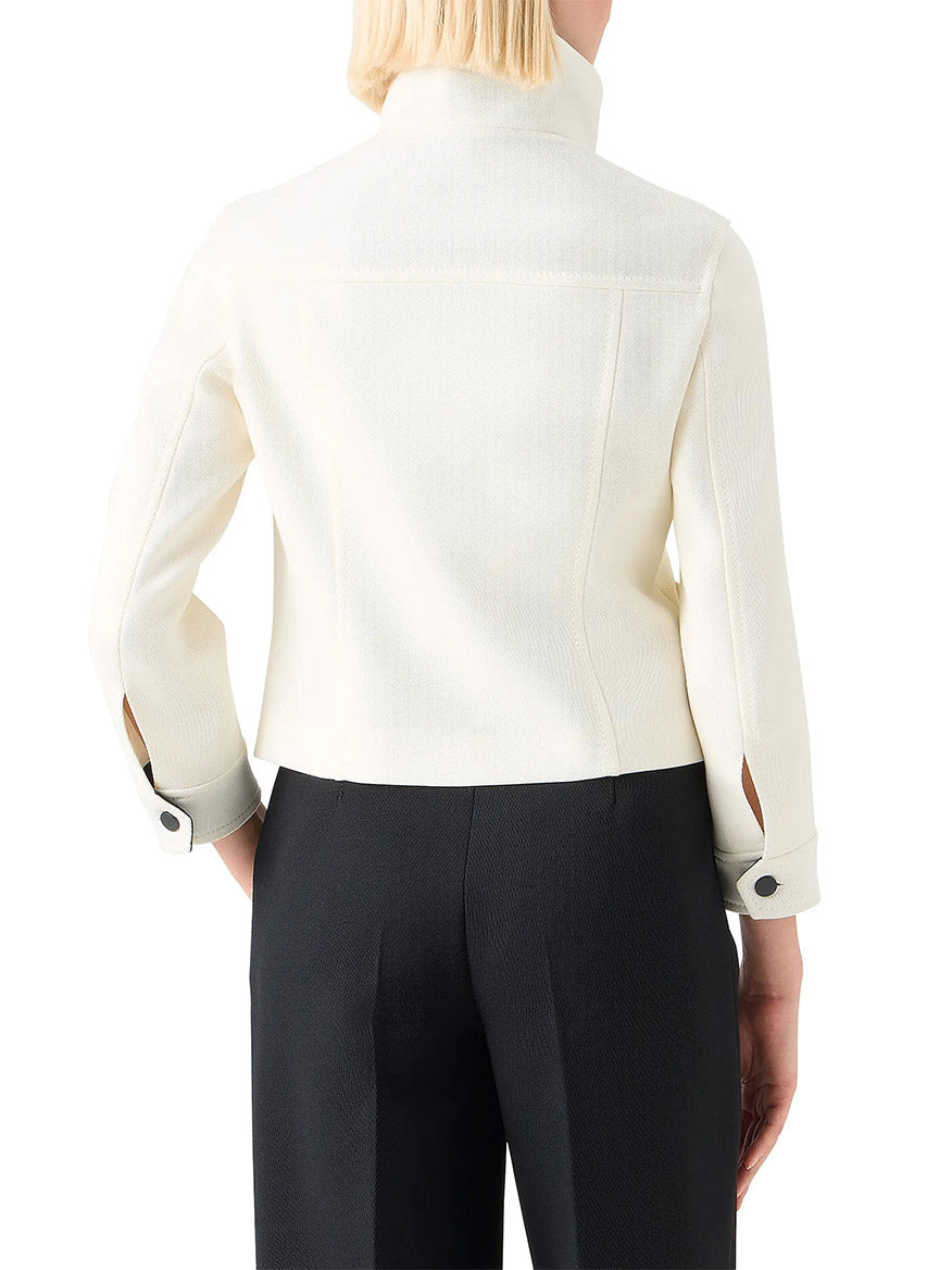 A person is shown from the back wearing an Akris Punto Wool Tricotine Stand Collar Jacket in Cream/Black with black trousers.