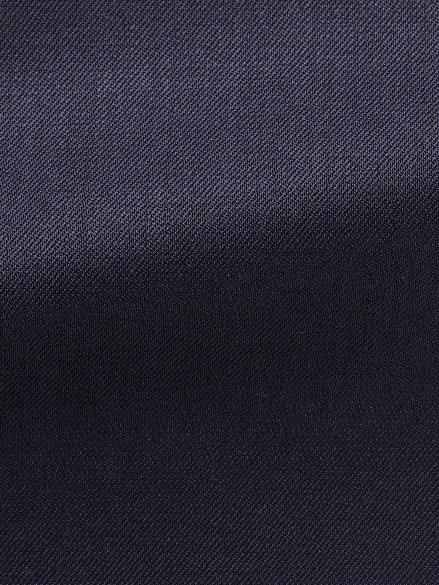 Close-up of Atelier Munro Midnight Blue Twill 4-Season Wool Stretch Suit fabric, featuring a subtle diagonal weave and soft lighting that highlights its refined texture—perfect for a modern, versatile suit.