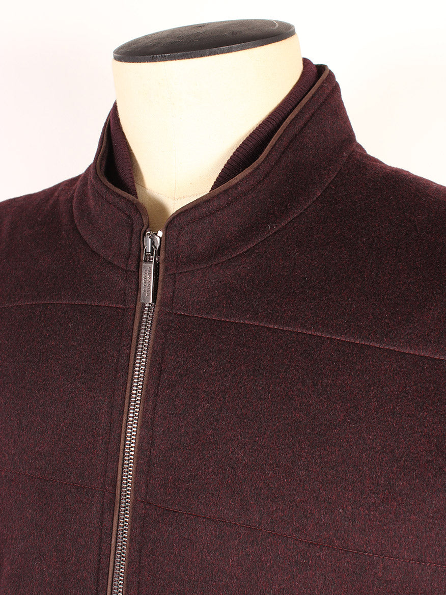 A close-up of the Maurizio Baldassari Arena Vest with Knit Sides in Plum, showcased on a mannequin torso against a plain background and featuring Thermore padding and a zippered front.