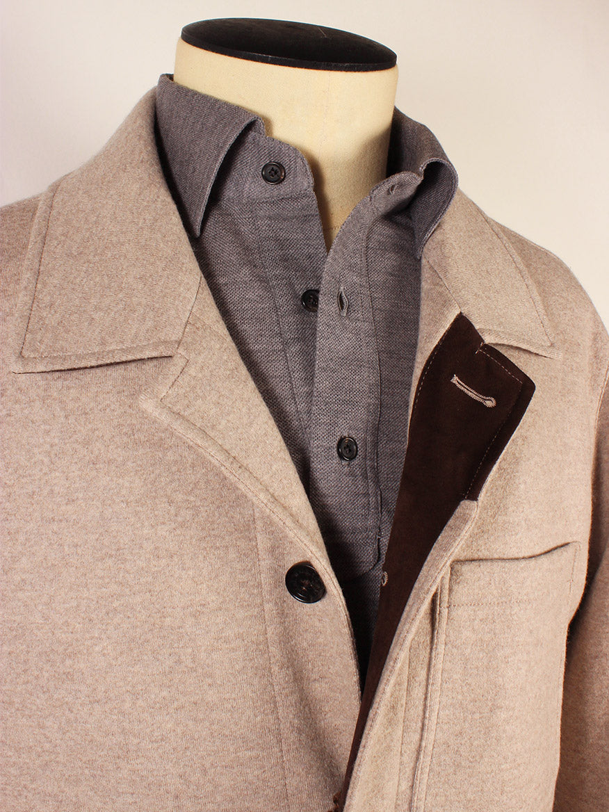 Close-up of a mannequin dressed in a Maurizio Baldassari Chore Padded Felt Jacket in Light Beige and a grey button-down shirt, made in Italy.