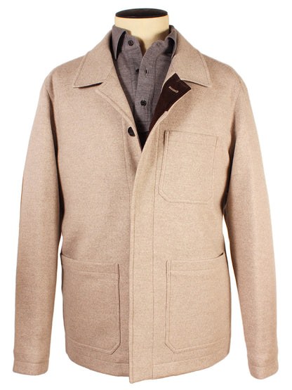 A Maurizio Baldassari Chore Padded Felt Jacket in light beige with multiple pockets, crafted from luxurious Merino wool, is displayed on a mannequin over a button-up shirt. Made in Italy, it exudes both style and craftsmanship.