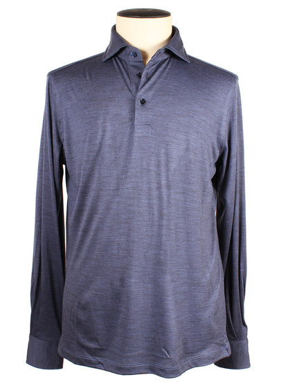 The Maurizio Baldassari 3-Button Long Sleeve Polo in Blue Stone, made from luxurious Merino wool and crafted in Italy, is displayed on a mannequin with a beige neck.