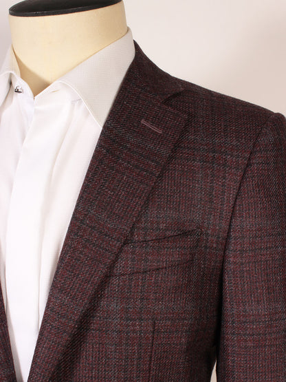 A close-up of a mannequin wearing a crisp white dress shirt and the Canali Flap Pocket Sport Jacket in Burgundy Plaid, made in Italy.