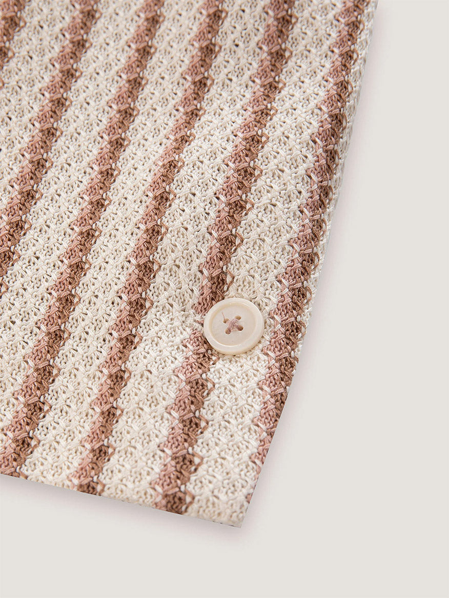 A close-up of the Circolo 1901 Slim Striped Long Jacket in Naturale Knitted shows its textured beige and brown vertical stripes with a single button closure—highlighting the jacket’s stylish detailing.