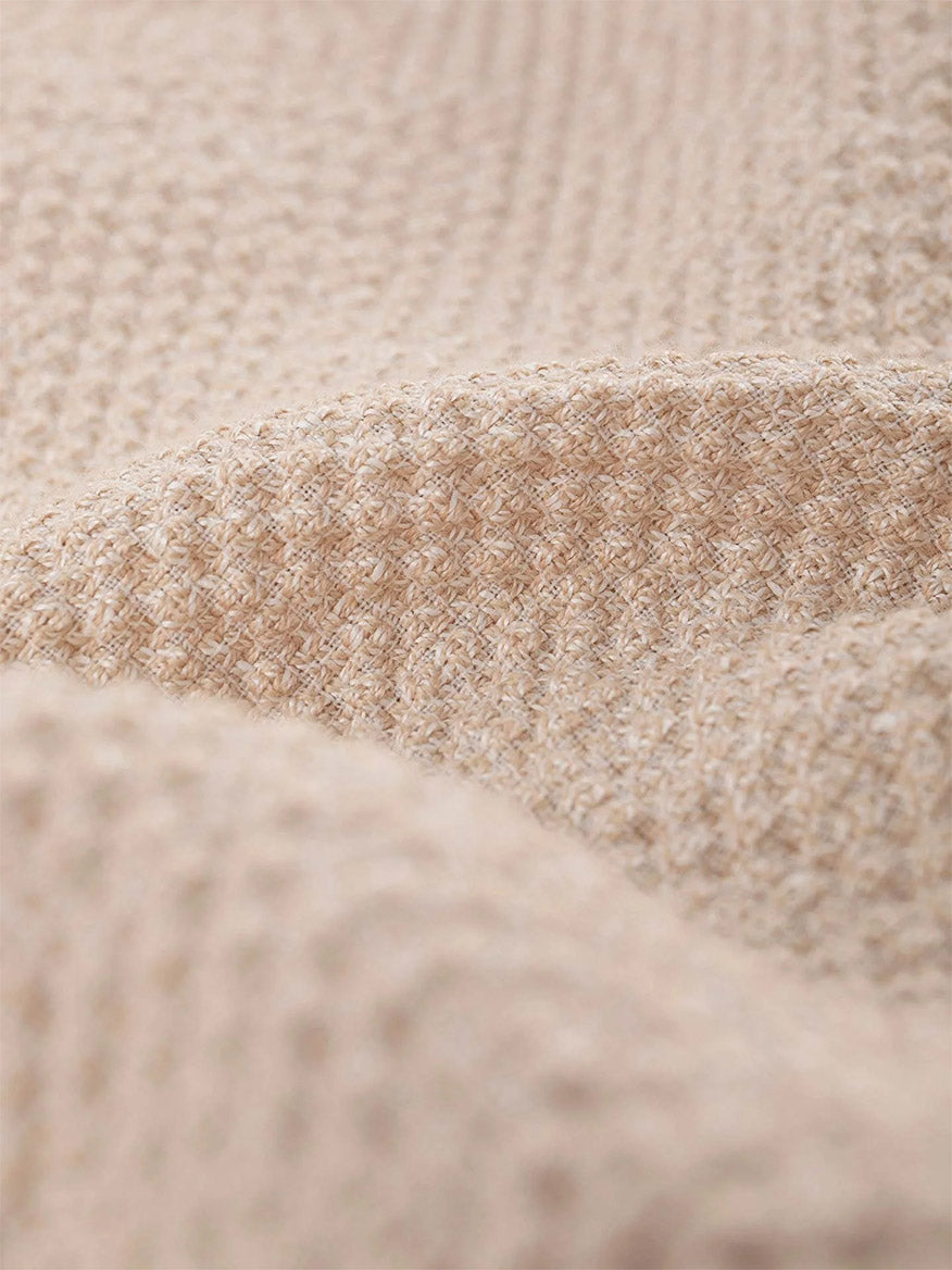 Close-up of beige linen bistretch fabric with a soft, waffle-like texture, featured in the Circolo 1901 Cropped 4-Pocket Jacket.