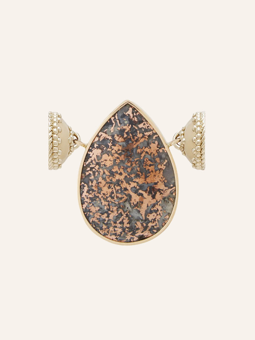 Introducing the Clara Williams 14K Copper Plume Agate Teardrop Centerpiece ring, beautifully crafted in 14K yellow gold and showcasing a striking teardrop-shaped copper plume agate with a distinctive brown and gray mottled pattern, complemented by textured bands on each side.