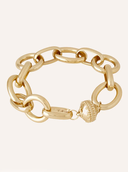 The Clara Williams Gold Coast Bracelet is a 14K yellow gold chunky chain with oval links and a crown-shaped decorative clasp.