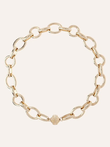 The Clara Williams Gold Coast Necklace, crafted in 14K yellow gold with large oval links and a decorative ClaraClasp, is shown on a plain background.