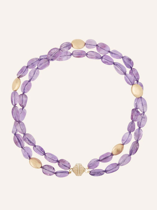 Clara Williams Gold Rush Amethyst Double-Strand Necklace with oval purple amethyst beads and round 14K yellow gold beads, finished with a gold clasp, displayed on a plain background in the brand's signature style.