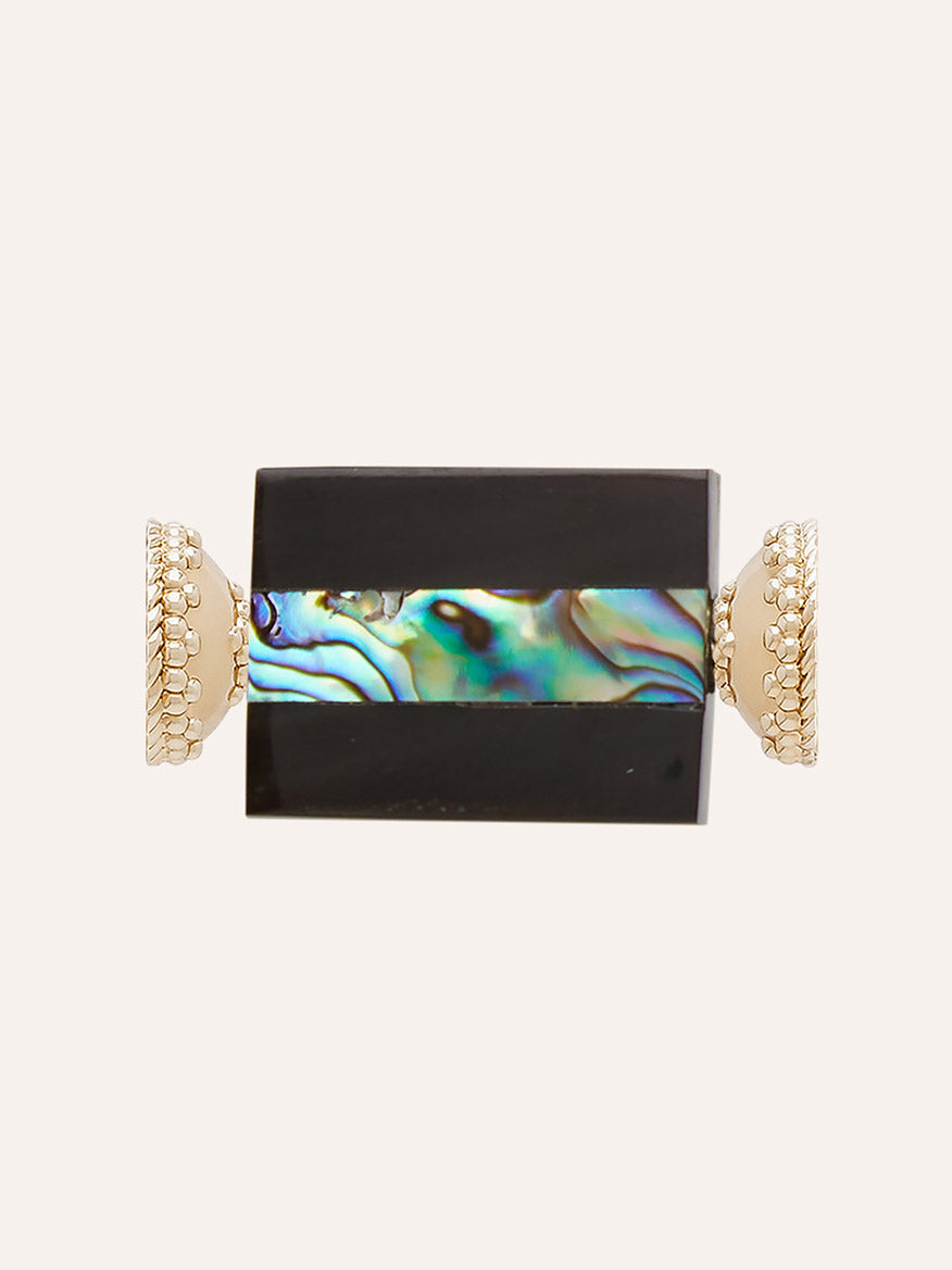Clara Williams New Zealand Abalone Resin Geo Centerpiece features a rectangular black and iridescent abalone stone set horizontally between two decorative 14K yellow gold end caps, creating a striking focal point against a light background.