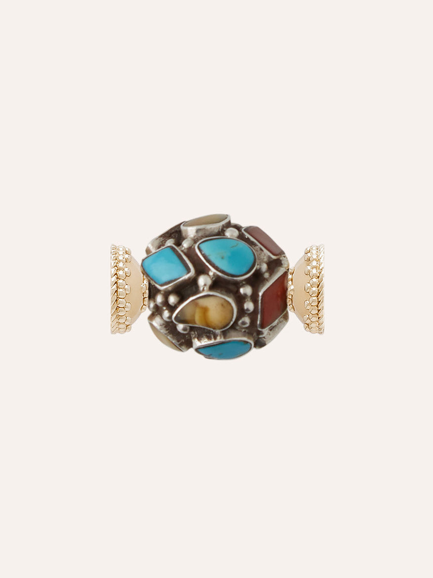 Clara Williams Tibetan Treasure Mixed Stone Mosaic Mini Centerpiece: A round bead adorned with irregular turquoise, red, and yellow mixed stone mosaic inlays, set in a silver base and finished with gold-toned, textured cylindrical end caps on each side—an eye-catching centerpiece inspired by Tibetan treasures.