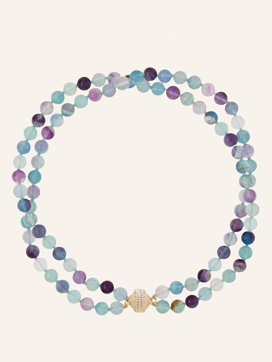 Clara Williams Victoire 8mm Multicolor Fluorite Double-Strand Necklace crafted from round beads in varying shades of blue, green, and purple, finished with a 14K gold clasp.