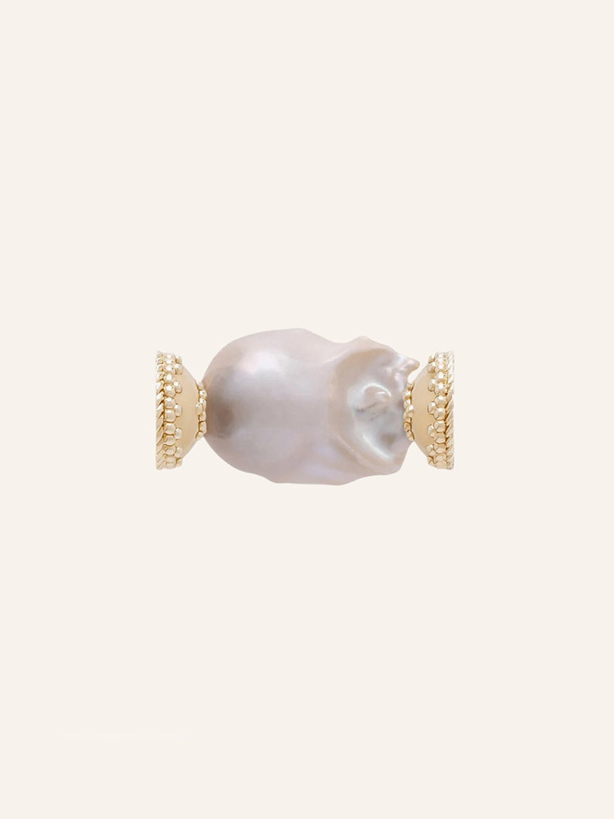 Clara Williams White Baroque Pearl Centerpiece showcased on a light beige background, featuring a large irregular freshwater baroque pearl set between two textured 14K yellow gold end caps.