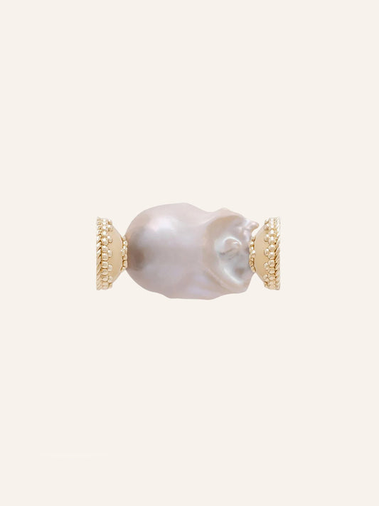 Clara Williams White Baroque Pearl Centerpiece showcased on a light beige background, featuring a large irregular freshwater baroque pearl set between two textured 14K yellow gold end caps.