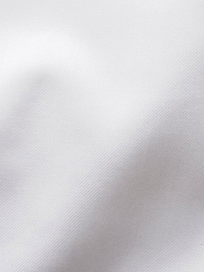 Close-up of the Eton Classic Fit Twill Dress Shirt in White, highlighting its subtle diagonal weave and soft folds for a refined, wrinkle-free finish.