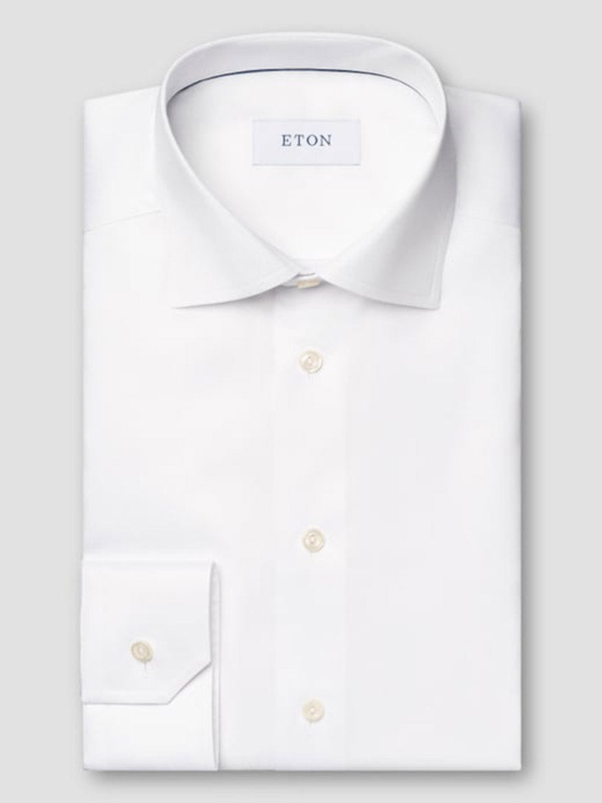 The Eton Classic Fit Twill Dress Shirt in White features long sleeves, a classic collar, and button cuffs—an exceptionally versatile choice for any occasion.