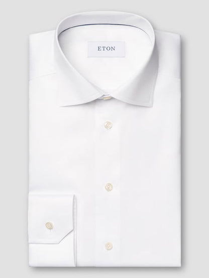 The Eton Classic Fit Twill Dress Shirt in White features long sleeves, a classic collar, and button cuffs—an exceptionally versatile choice for any occasion.