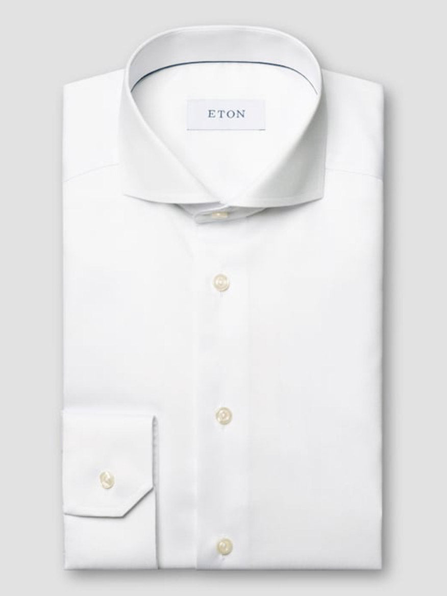 The Eton Contemporary Fit White Extreme Cut Away Dress Shirt features crisp twill fabric, an extreme cut away collar, button cuffs, and the signature Eton label inside the collar.