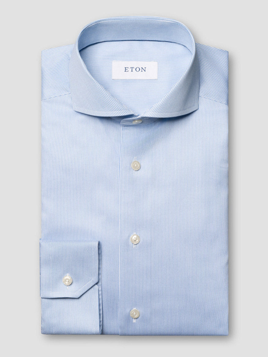 The Eton Slim Fit Fine Striped Signature Twill Dress Shirt in Light Blue features an extreme cut away collar and subtle stripes—an ideal choice for a classic business look.