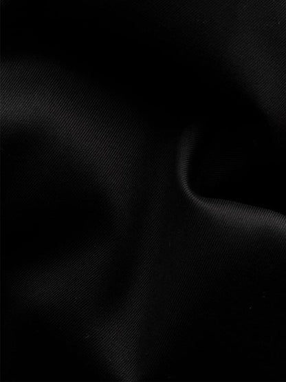 Close-up of the Eton Slim Fit Fine Striped Bib Evening Shirt in Black, highlighting its elegant French cuffs, black fabric with visible folds, and subtle textured stripes.