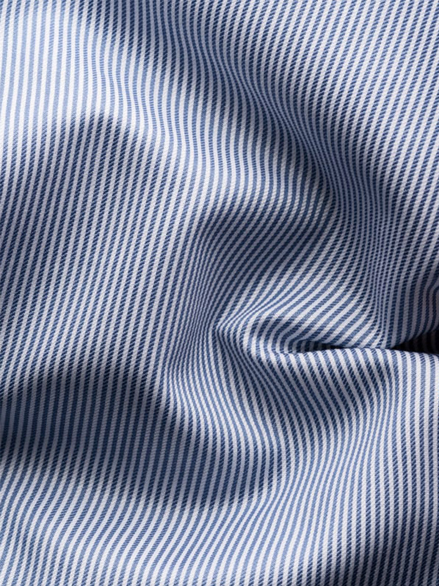 Close-up of the Eton Contemporary Fit Fine Striped Signature Twill Dress Shirt in Mid Blue, featuring blue and white vertical stripes—ideal for a classic business look.