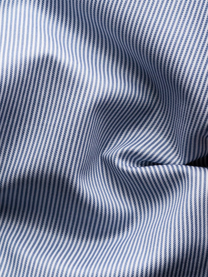 Close-up of the Eton Contemporary Fit Fine Striped Signature Twill Dress Shirt in Mid Blue, featuring blue and white vertical stripes—ideal for a classic business look.