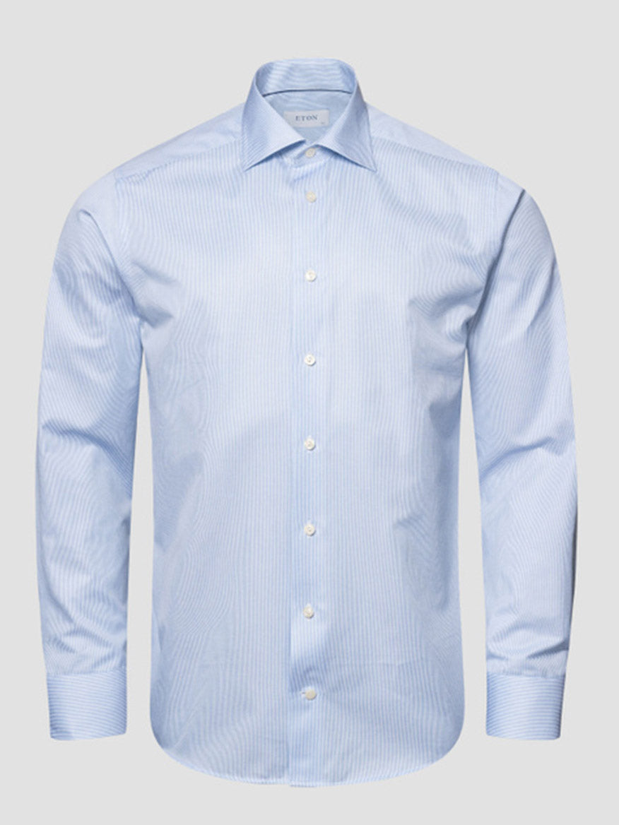 Eton Slim Fit Fine Striped Signature Twill Dress Shirt in light blue, featuring a cut away collar and subtle stripes—a business classic—displayed on a plain gray background.