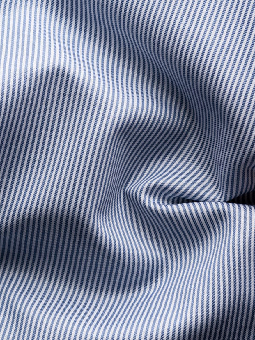 Close-up of the Eton Slim Fit Fine Striped Signature Twill Dress Shirt in Mid Blue, featuring blue and white stripes with visible folds—ideal for a timeless business look.