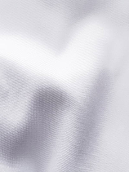 Close-up of the Eton Contemporary Fit Fly Front Signature Twill Evening Shirt in White, crafted from soft organic cotton with a subtle diagonal weave—ideal for elegant evening wear with French cuffs and refined folds.